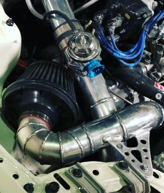Detailed high-performance engine in a workshop